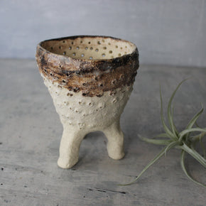 Pierced Legged Vessels