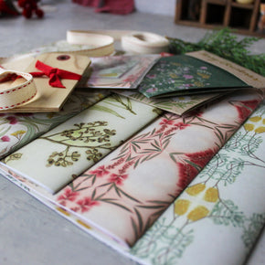 Collection of floral-patterned envelopes on a table